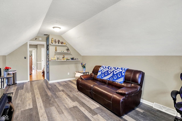 6820 W Forest Brook Dr, Fountaintown, IN 46130 - living area featuring wood finished floors, vaulted ceiling, and baseboards