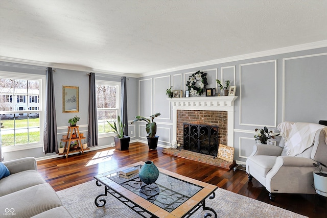 6820 W Forest Brook Dr, Fountaintown, IN 46130 - living area with a decorative wall, plenty of natural light, wood finished floors, crown molding, and a brick fireplace