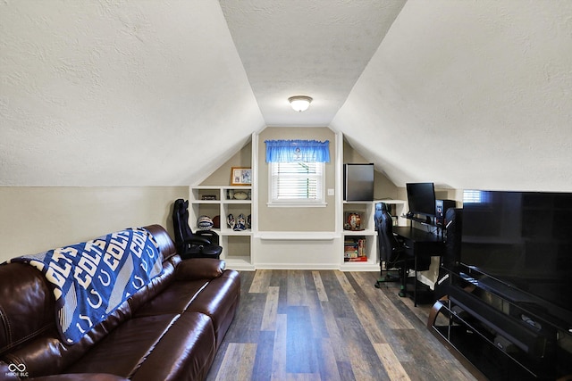 6820 W Forest Brook Dr, Fountaintown, IN 46130 - living room featuring a textured ceiling, wood finished floors, lofted ceiling, and a desk
