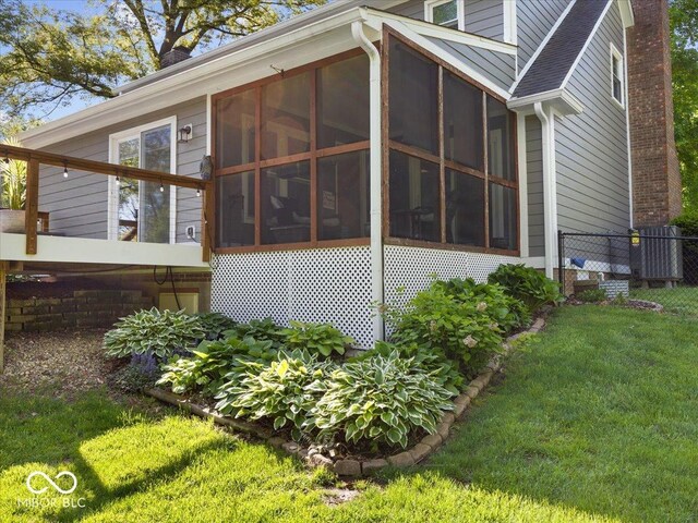6820 W Forest Brook Dr, Fountaintown, IN 46130 - rear view of house with a sunroom and a chimney
