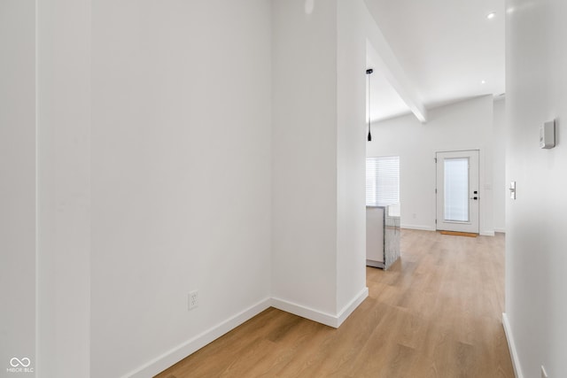 2362 English Ave, Indianapolis, IN 46201 - hallway featuring baseboards, light wood-style floors, and beamed ceiling