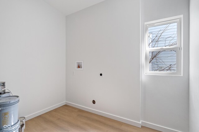 2362 English Ave, Indianapolis, IN 46201 - laundry area featuring hookup for an electric dryer, hookup for a washing machine, baseboards, light wood-style floors, and laundry area