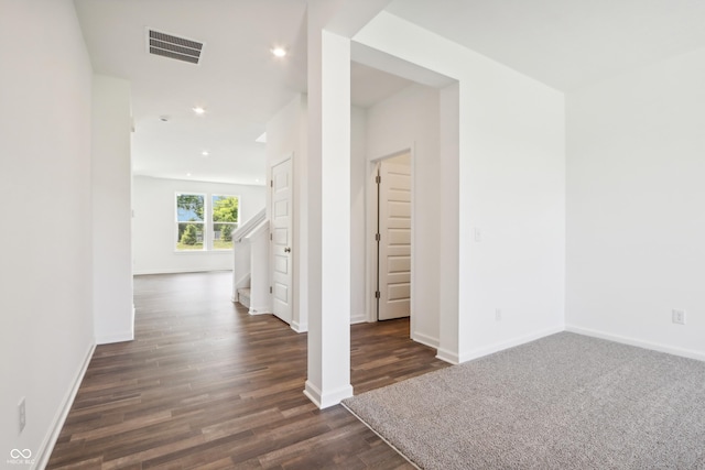 interior space featuring baseboards, visible vents, recessed lighting, and dark wood-style flooring