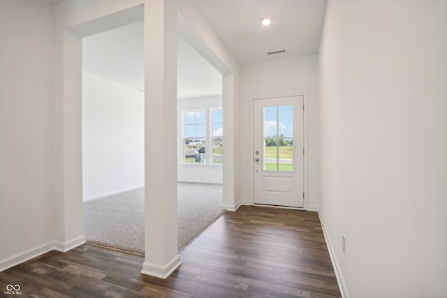 entryway with recessed lighting, dark wood-style floors, baseboards, and visible vents