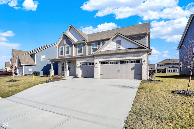 950 Edmonds Pl, Greenwood, IN 46143 - craftsman-style home featuring driveway, a garage, a front yard, and brick siding