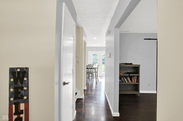 8315 San Marcos Cir, Indianapolis, IN 46256 - corridor featuring dark wood-style flooring and french doors