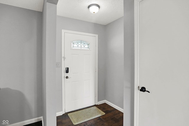 8315 San Marcos Cir, Indianapolis, IN 46256 - entrance foyer featuring dark wood finished floors and a textured ceiling