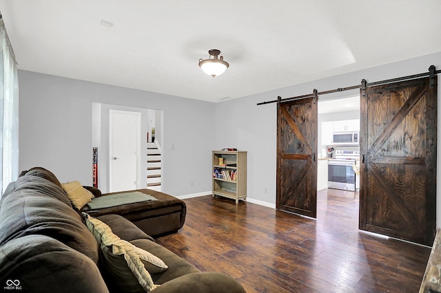 8315 San Marcos Cir, Indianapolis, IN 46256 - living room with a barn door and hardwood / wood-style flooring