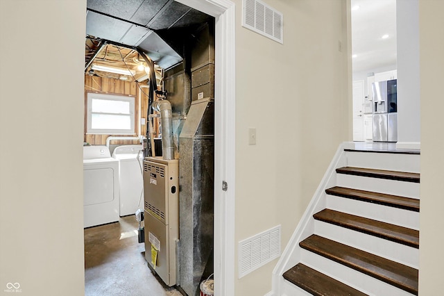 8315 San Marcos Cir, Indianapolis, IN 46256 - stairway featuring washing machine and dryer, concrete flooring, and recessed lighting