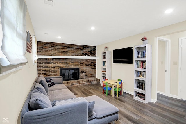 8315 San Marcos Cir, Indianapolis, IN 46256 - living room with wood finished floors, a fireplace, and recessed lighting