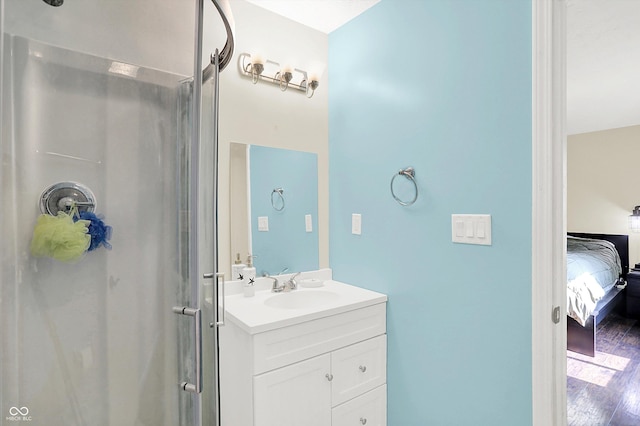 8315 San Marcos Cir, Indianapolis, IN 46256 - bathroom with connected bathroom, vanity, wood finished floors, and a shower with door