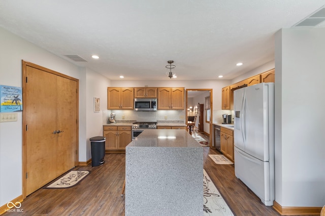 1864 Holiday Pines Dr, Brownsburg, IN 46112 - kitchen featuring appliances with stainless steel finishes, a center island, dark wood finished floors, recessed lighting, and baseboards
