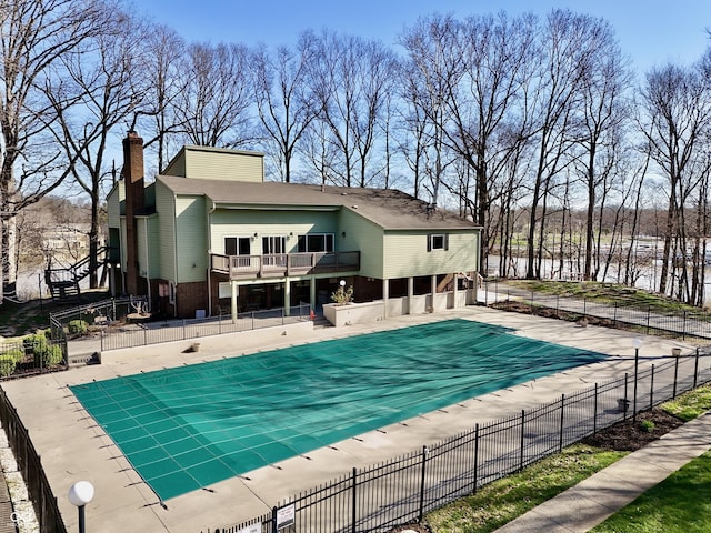 pool featuring a patio area and fence