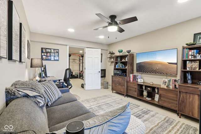 carpeted living area featuring ceiling fan and recessed lighting