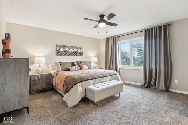 carpeted bedroom featuring baseboards and ceiling fan