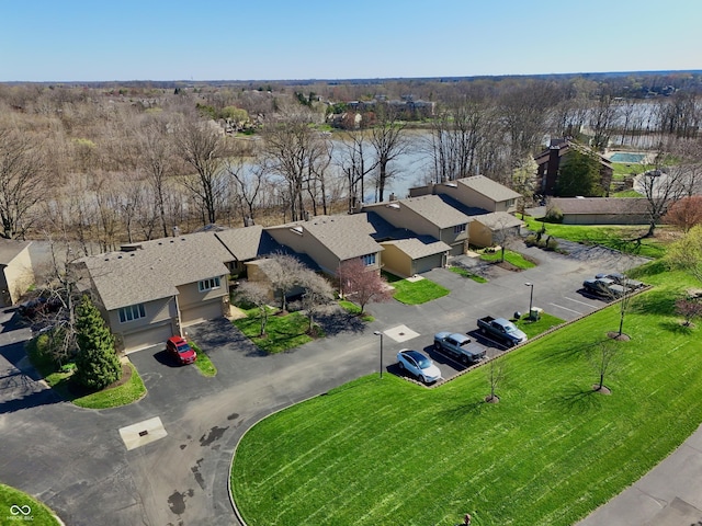 drone / aerial view featuring a residential view and a water view