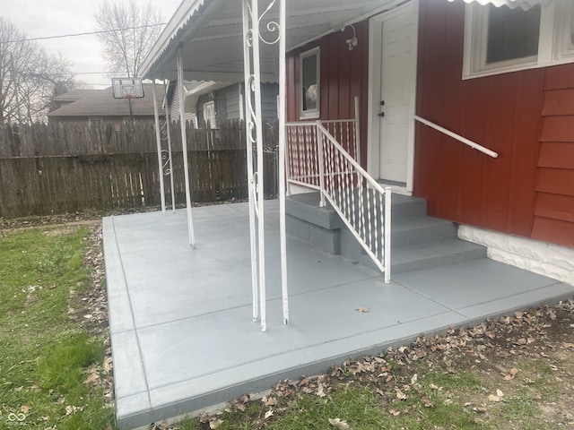 view of patio featuring fence