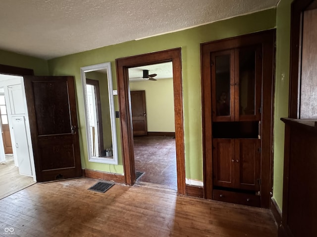 3179 W 400 N, Fairland, IN 46126 - corridor with wood finished floors, baseboards, and a textured ceiling