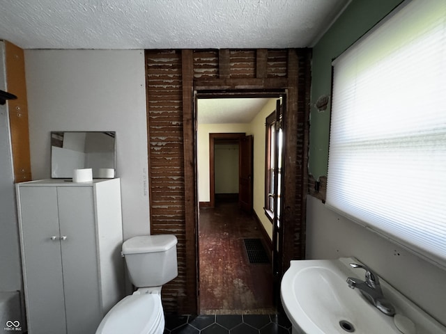 3179 W 400 N, Fairland, IN 46126 - bathroom with a sink, a textured ceiling, tile patterned floors, and toilet