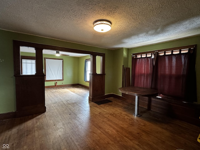 3179 W 400 N, Fairland, IN 46126 - foyer entrance with baseboards, hardwood / wood-style floors, a textured ceiling, and decorative columns