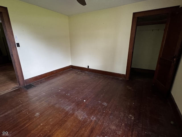 3179 W 400 N, Fairland, IN 46126 - unfurnished bedroom featuring hardwood / wood-style flooring, baseboards, a closet, and a ceiling fan