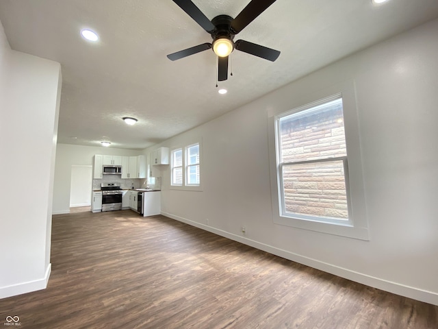 1518 Lawton Ave, Indianapolis, IN 46203 - unfurnished living room featuring dark wood-style floors, a ceiling fan, and recessed lighting