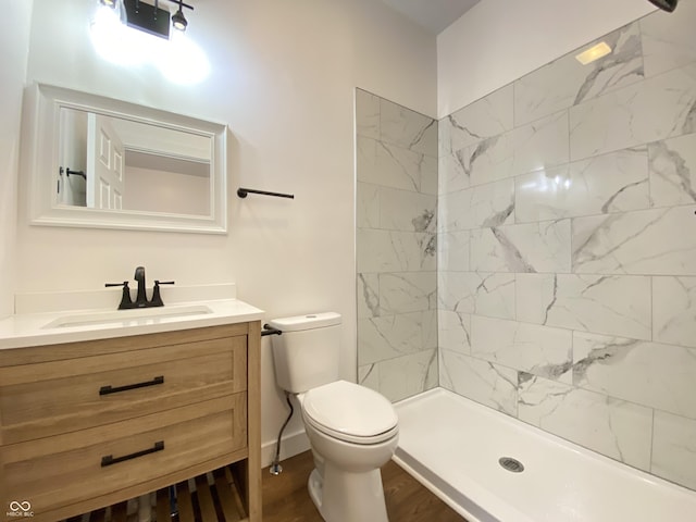 1518 Lawton Ave, Indianapolis, IN 46203 - full bath with vanity, wood finished floors, and tiled shower