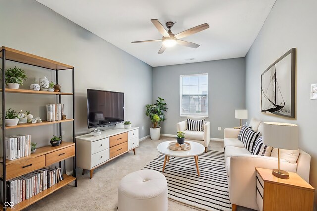 5150 Bramwell Ln, Whitestown, IN 46075 - living room featuring a ceiling fan, light colored carpet, and baseboards