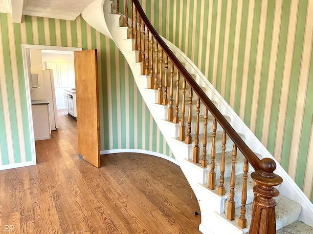 7180 N State Road 42, Eminence, IN 46125 - stairway with baseboards, wallpapered walls, and wood finished floors