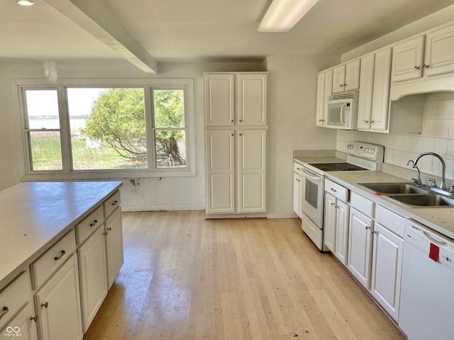 7180 N State Road 42, Eminence, IN 46125 - kitchen with tasteful backsplash, white appliances, white cabinets, light wood finished floors, and a sink