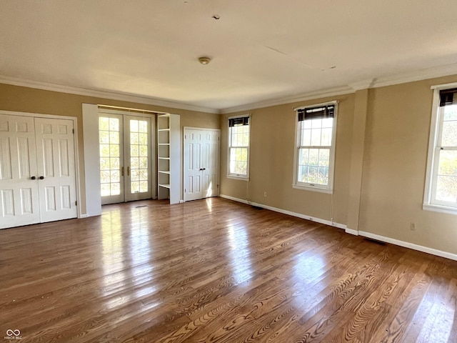 7180 N State Road 42, Eminence, IN 46125 - empty room featuring french doors, ornamental molding, baseboards, and wood finished floors
