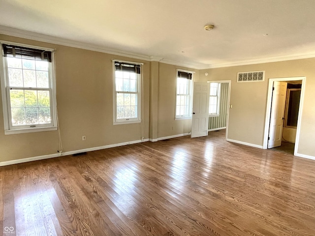 7180 N State Road 42, Eminence, IN 46125 - spare room featuring visible vents, crown molding, and wood finished floors