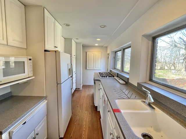 7180 N State Road 42, Eminence, IN 46125 - kitchen with white appliances, white cabinets, recessed lighting, wood finished floors, and a sink