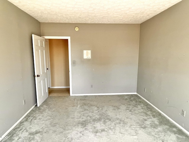 7180 N State Road 42, Eminence, IN 46125 - carpeted empty room with baseboards and a textured ceiling