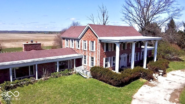 7180 N State Road 42, Eminence, IN 46125 - view of front of home featuring brick siding and a front lawn