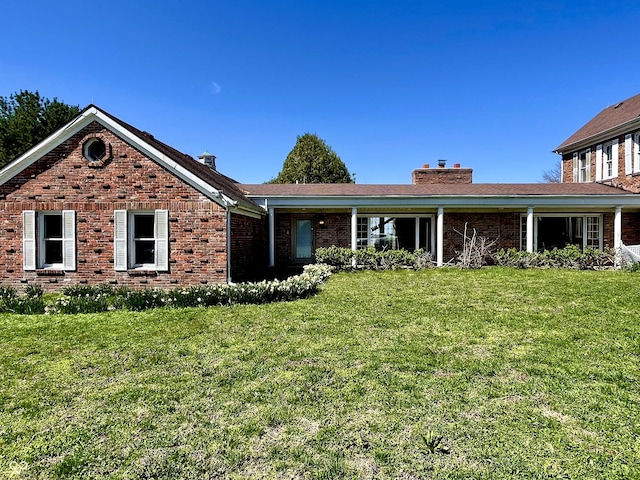 7180 N State Road 42, Eminence, IN 46125 - ranch-style house featuring brick siding, a chimney, and a front lawn