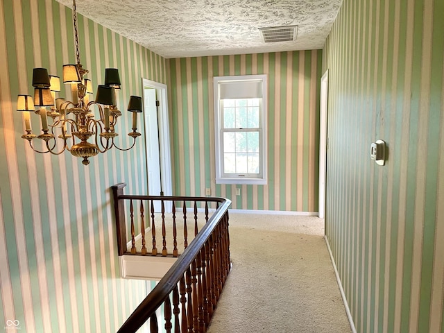 7180 N State Road 42, Eminence, IN 46125 - hallway with carpet, visible vents, a textured ceiling, and wallpapered walls