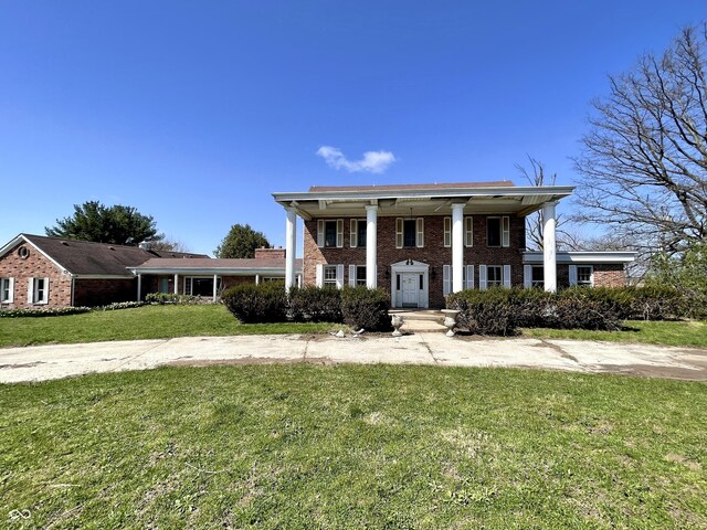 7180 N State Road 42, Eminence, IN 46125 - neoclassical / greek revival house with a front yard and brick siding