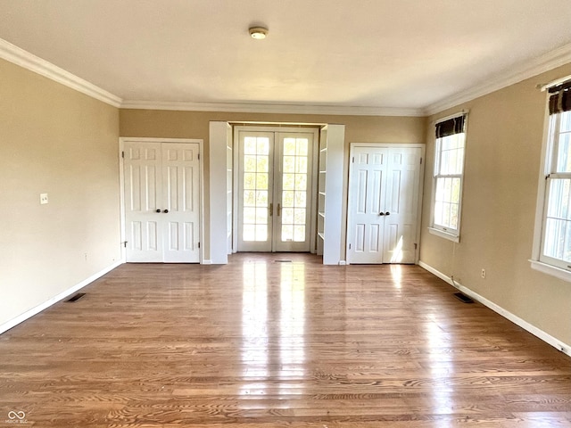 7180 N State Road 42, Eminence, IN 46125 - unfurnished bedroom featuring access to outside, french doors, wood finished floors, and multiple windows