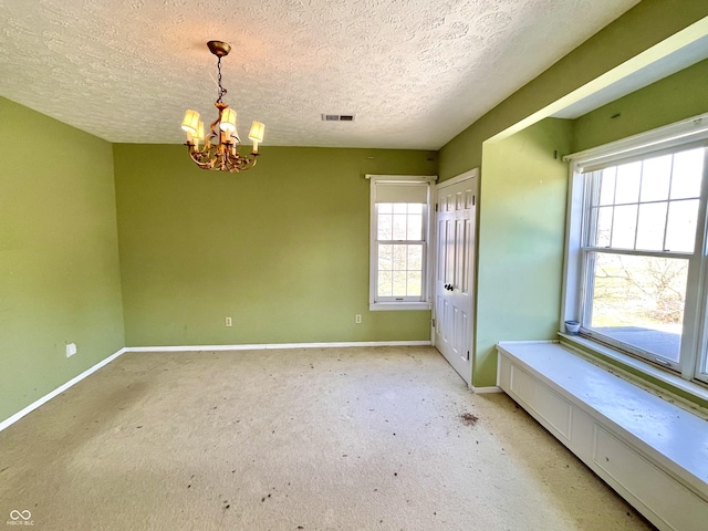 7180 N State Road 42, Eminence, IN 46125 - interior space with baseboards, a chandelier, carpet flooring, a textured ceiling, and visible vents
