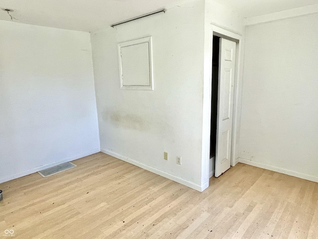 7180 N State Road 42, Eminence, IN 46125 - unfurnished room featuring light wood-style floors, visible vents, and baseboards