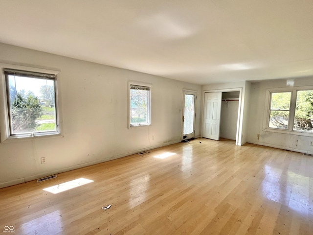 7180 N State Road 42, Eminence, IN 46125 - unfurnished bedroom featuring visible vents, light wood finished floors, and multiple windows