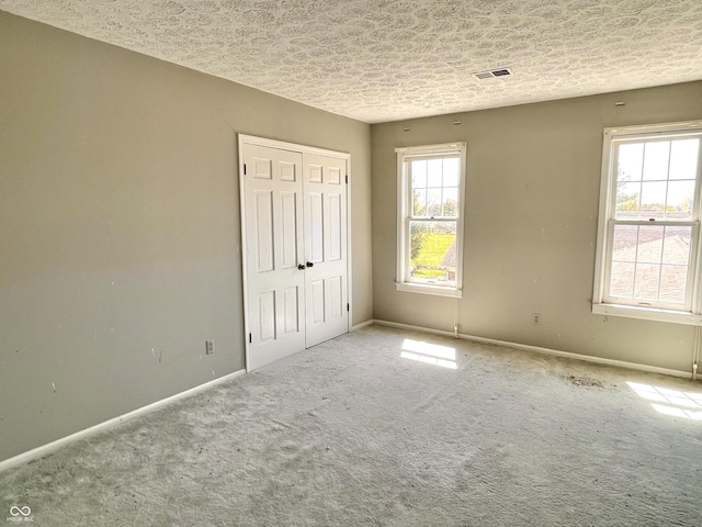 7180 N State Road 42, Eminence, IN 46125 - unfurnished bedroom with a closet, visible vents, baseboards, and a textured ceiling