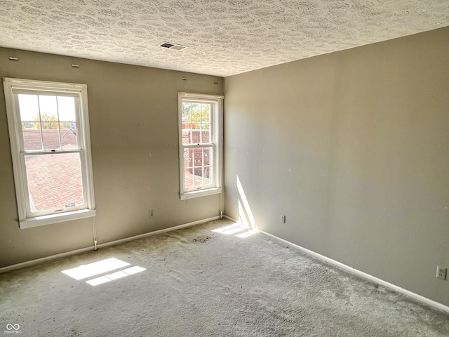 7180 N State Road 42, Eminence, IN 46125 - empty room with visible vents, a textured ceiling, baseboards, and carpet floors