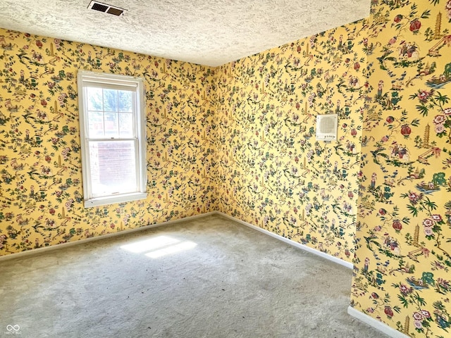 7180 N State Road 42, Eminence, IN 46125 - spare room featuring carpet flooring, visible vents, a textured ceiling, and baseboards