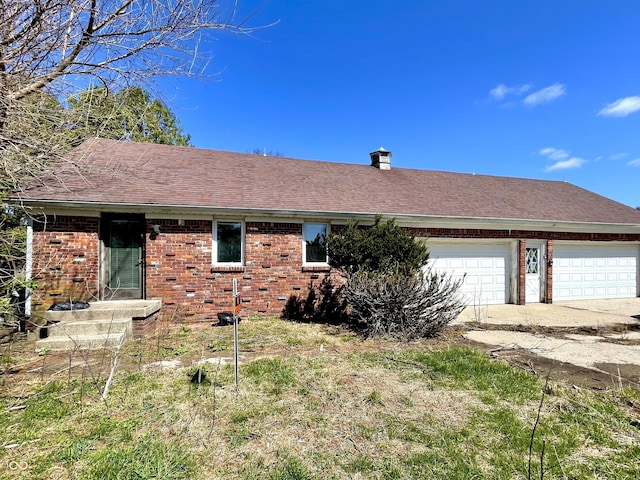 7180 N State Road 42, Eminence, IN 46125 - exterior space with brick siding, driveway, a garage, and roof with shingles