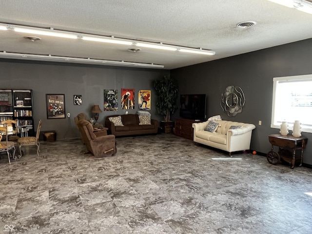 living room featuring visible vents and a textured ceiling