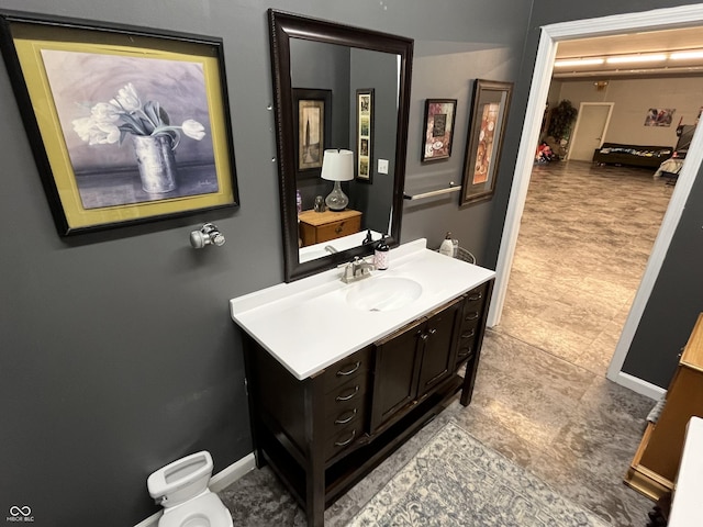 bathroom with baseboards and vanity