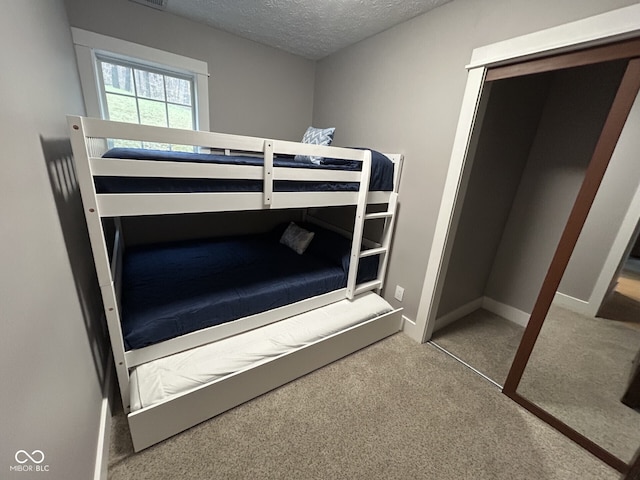 9378 Derrett Rd, Unionville, IN 47468 - bedroom featuring baseboards, carpet flooring, and a textured ceiling