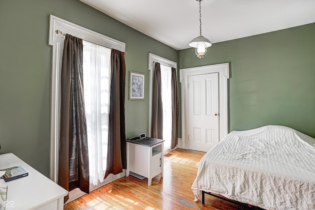 110 E Hendricks St, Shelbyville, IN 46176 - bedroom with light wood-style flooring, a closet, and multiple windows